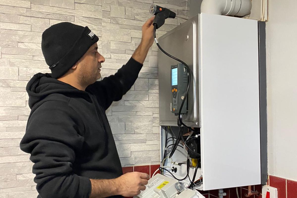 Emergency boiler repair with tools and open boiler casing