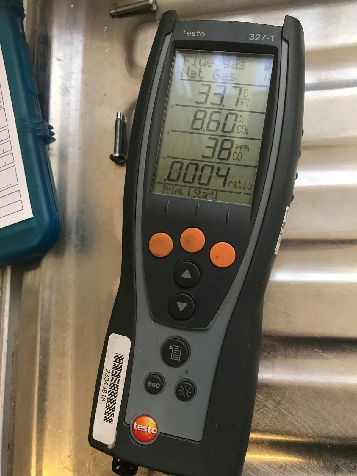 Close-up flue gas analyser readings during boiler service