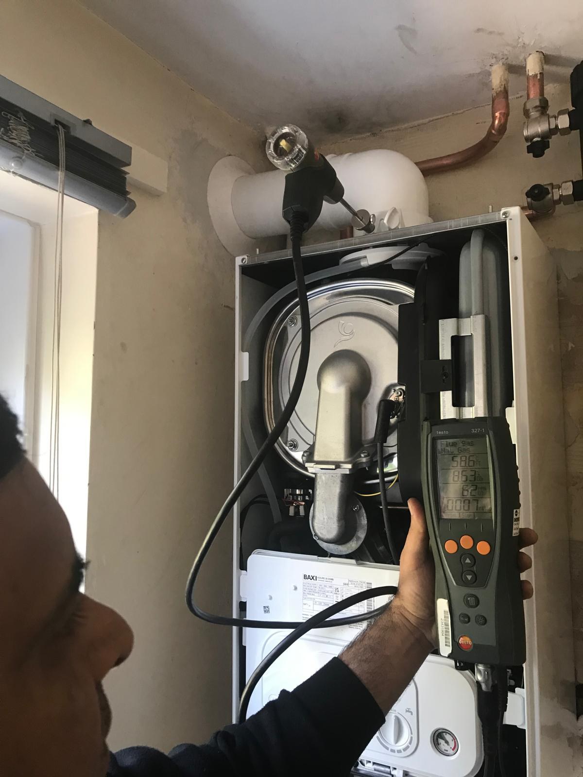 Flue gas analyser close-up showing gas safety readings